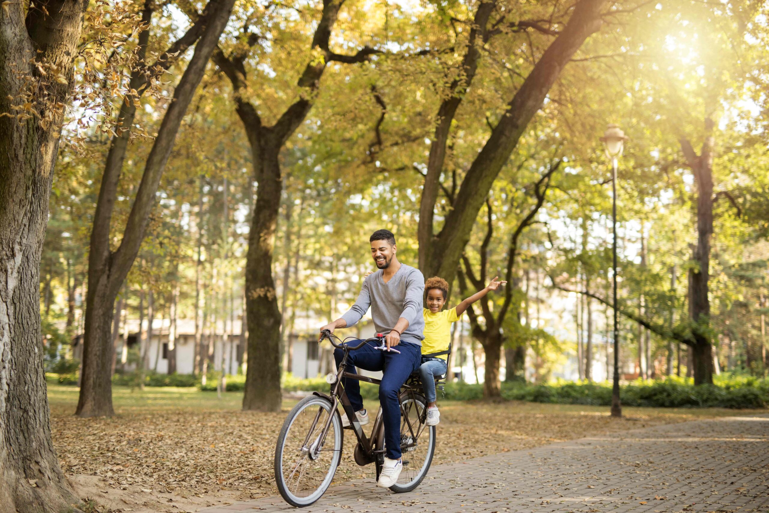 father and daughter enjoying bicycle ride